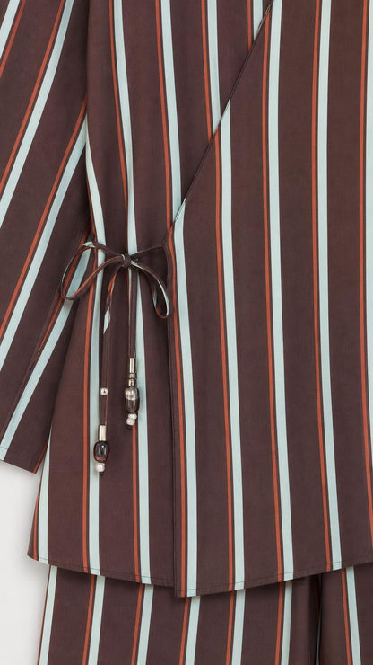 Close-up of wrap top side tie detail with beads